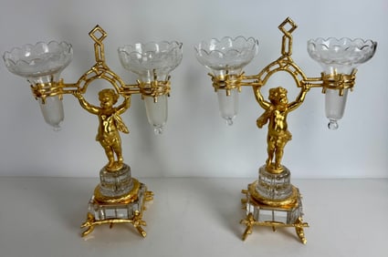 A PAIR OF ORMOLU MOUNTED BACCARAT FLOWER HOLDERS
