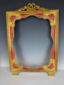 A LARGE FRENCH ORMOLU AND ENAMEL FRAME