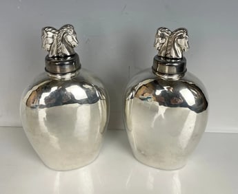 A PAIR OF HAND MADE STERLING SILVER BOTTLES BY ADAM AD,ER