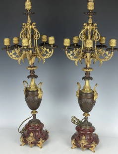 A FINE PAIR OF 19TH C. ROUGE MARBLE AND BRONZE CANDELABRA: Turned in to lamps. Overall night 38 inches , and 28 inches up to electrical fitting. In good antique condition. Estimate $2.000-3.000