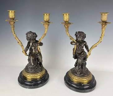 A PAIR BRONZE AND MARBLE CANDELABRA: Circa 1900. Measure 16 inches tall. In good used condition. Estimate $2.500-3.000
