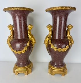 A PAIR OF ORMOLU MOUNTED PORPHYRY VASES