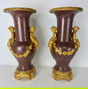 A PAIR OF ORMOLU MOUNTED PORPHYRY VASES