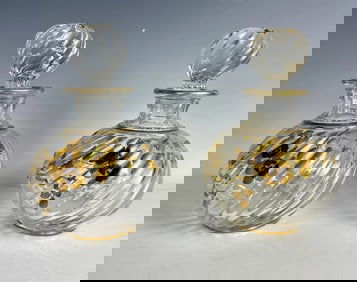 A PAIR OF GILT AND ENAMELED PERFUME BOTTLES