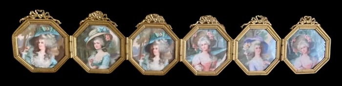 A 6 PICTURE HOLDING ORMOLU FRAME