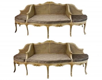 A PAIR OF LOUIS XV STYLE PAINTED AND CANED PARCEL GILT