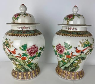 A PAIR OF CHINESE PORCELAIN JARS AND COVERS