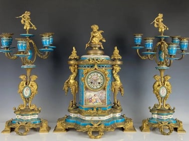 A MAGNIFICENT JEWELLED SEVRES CLOCK SET