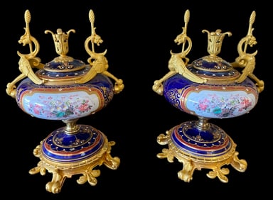 A PAIR OF JEWELLED SEVRES PORCELAIN ORMOLU MOUNTED VASES