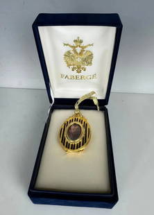 MINIATURE ENAMEL IMPERIAL FABERGE PICTURE FRAME: Faberge miniature picture frame in original box. Framework in enamel with gold features of olive branches, plated 24k finish and Swarovski crystal details Photograph can be replaced. Faberge backstamp