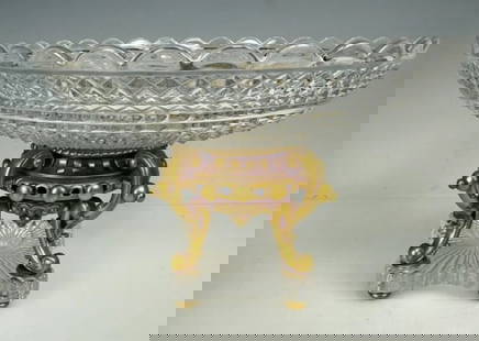 A SIGNED ORMOLU MOUNTED BACCARAT CRYSTAL CENTERPIECE: Circa 1900. Measures 9 inches d. , 6 inches h. In good condition. Stamped Baccarat on the bronze .Estimate $1.000-1.200