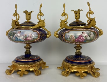 A PAIR OF JEWELLED SEVRES PORCELAIN ORMOLU MOUNTED VASES