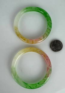 A PAIR OF CHINESE JADITE BRACELETS: In good condition. Estimate $500-600