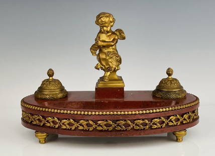 19TH C. DORE BRONZE AND ROUGES MARBLE INKWELL: Measure 12.75 inches x 8 inches tall. Mable seems to have had some minor restoration, not visible.Estimate $600-800