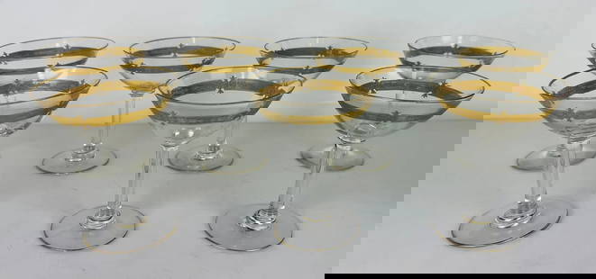 SET OF 7 MOSER STYLE GILT CHAMPAGNE GLASSES: Measure 6.5 inches h. In good condition. Estimate $300-500