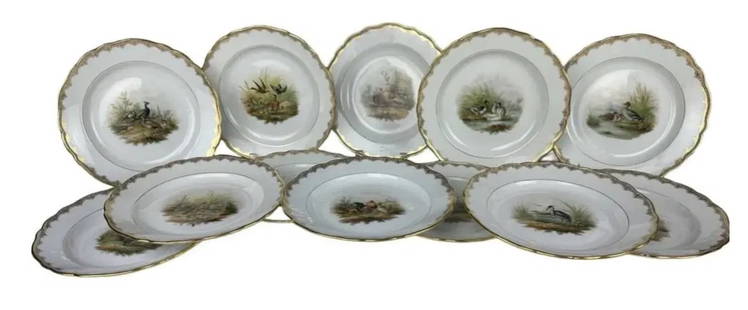 SET OF 12 MEISSEN PLATES: Circa 1900. All with first quality Meissen marks. . Each hand painted with different scenes. Measure 10 inches d. No breaks, no chips, no restorations. In overall good condition, minor loss of gold. E