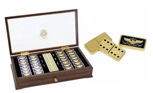IMPERIAL FABERGE 22KT GOLD PLATED ENAMELED DOMINO SET: A RARE SET OF 22K GOLD PLATED IMPERIAL HOUSE OF FABERGE DOMINOS within original box. 37 cm x 20 cm.Good condition. Estimate $2.000-2.500