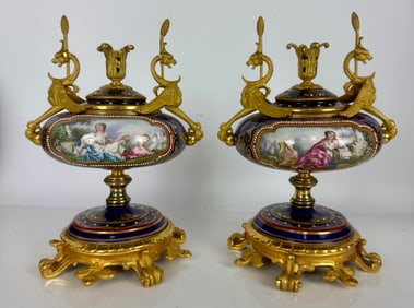 A FINE PAIR OF ORMOLU MOUNTED JEWELLED SEVRES GARNITURES
