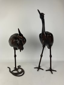 A LARGE PAIR OF JAPANESE BRONZE CRANES