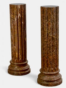 A NEAR PAIR OF MARBLE COLUMNS