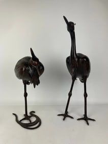 A LARGE PAIR OF JAPANESE BRONZE CRANES