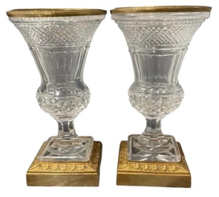 A PAIR OF ORMOLU MOUNTED CUT CRYSTAL VASES