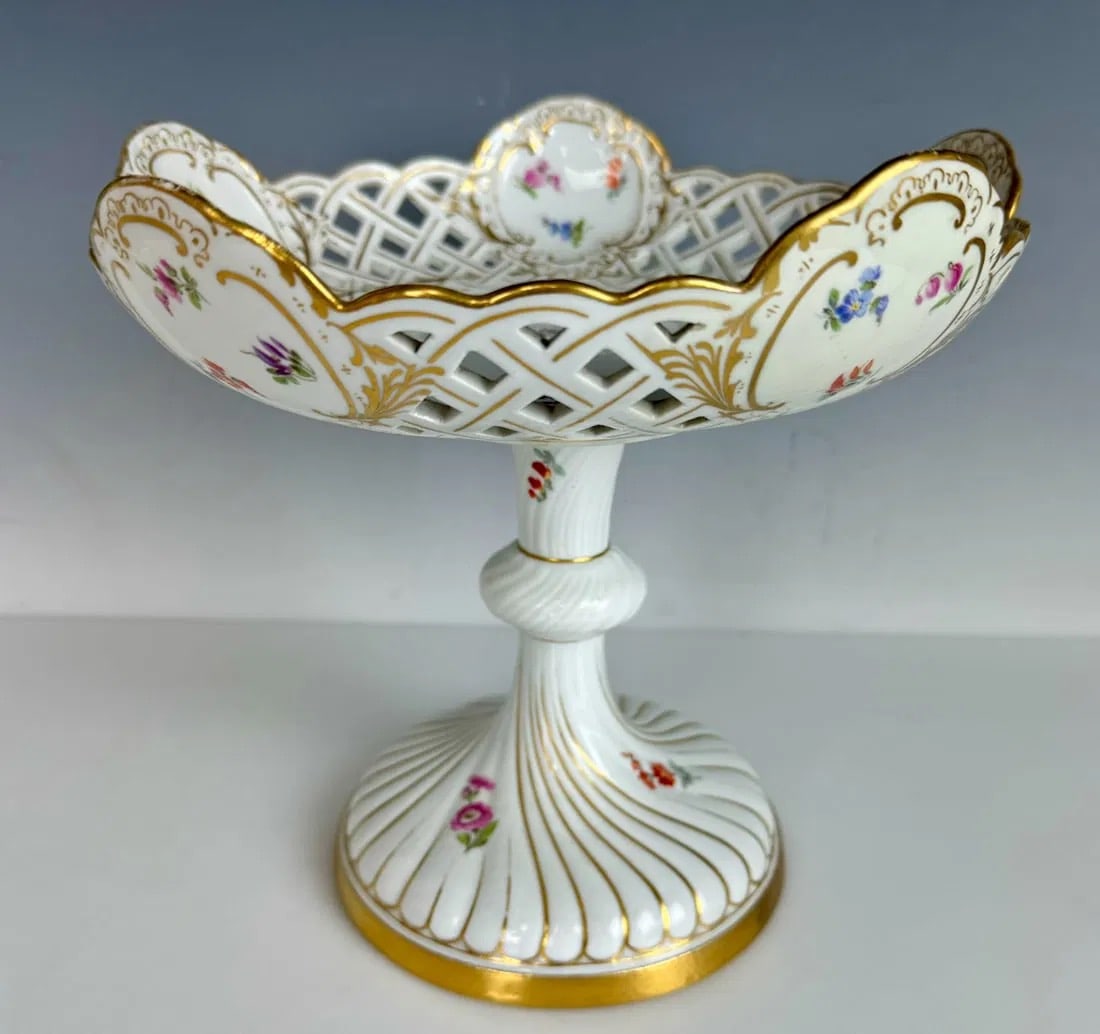 19TH C. MEISSEN RETICULATED CAKE STAND: First quality. Measures 9 inches d., 9 inches high. In good condition. Estimate $400-500