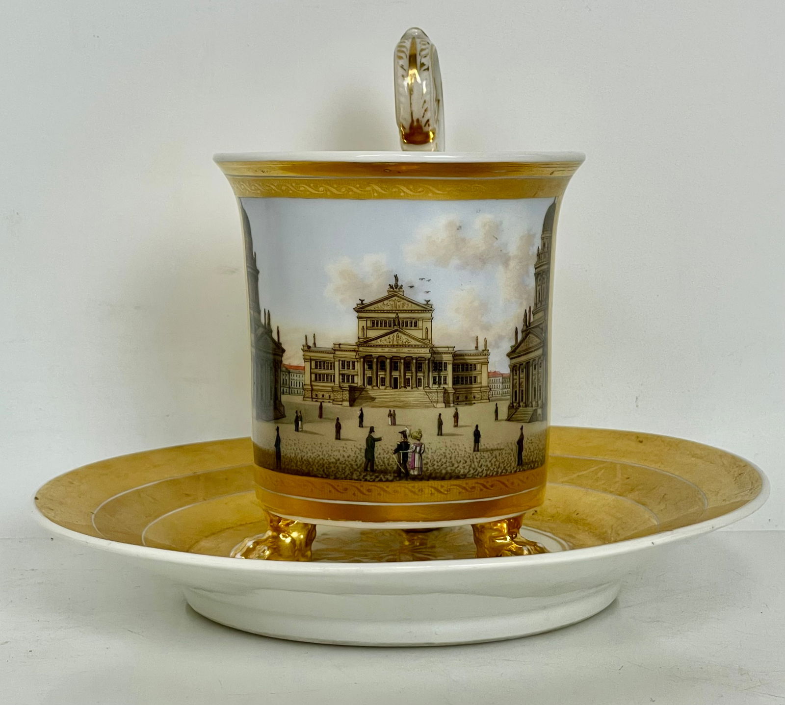 A LARGE BERLIN KPM PORCELAIN CUP AND SAUCER: Circa 1880. Saucer measures 6” d. No breaks, no repairs, in overall good condition. Estimate $1000-1200