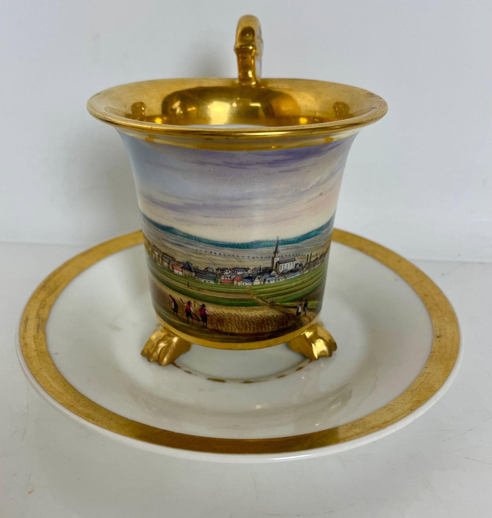 19TH C. GERMAN PORCELAIN CUP AND SAUCER: In overall good condition. Minor loss of fold. Estimate $600-800