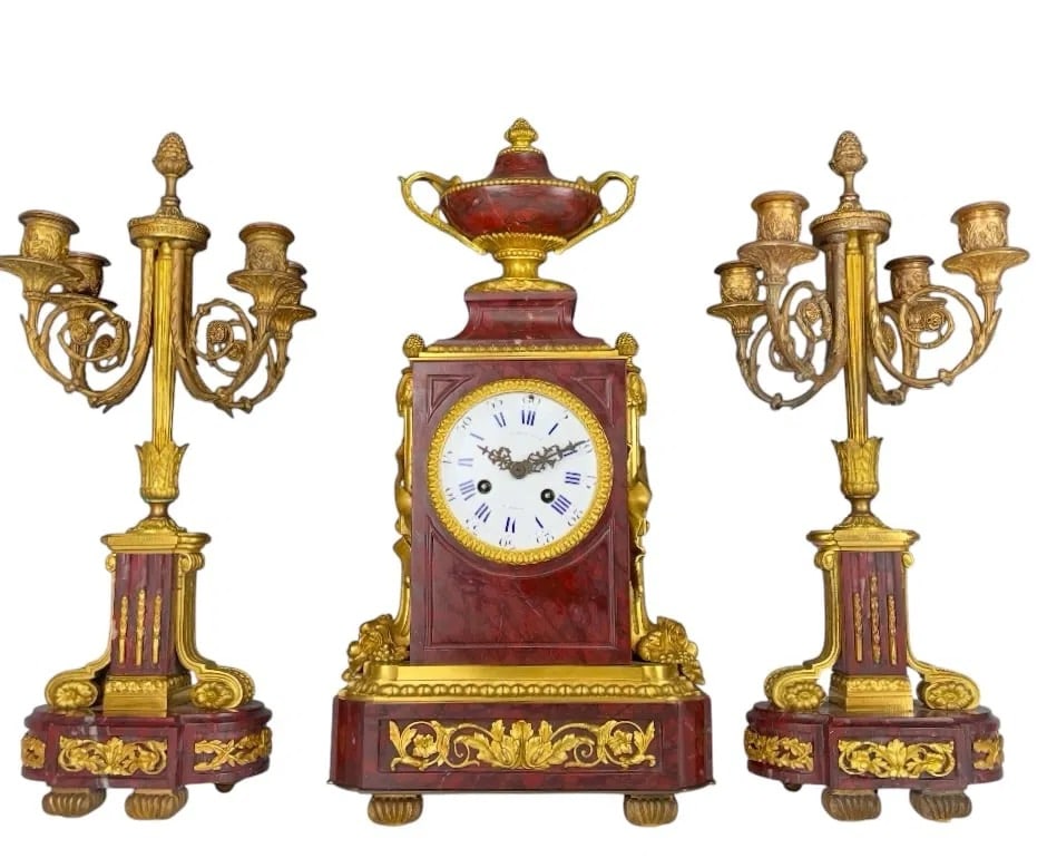 19TH C. ORMOLU AND ROUGE MARBLE CLOCK SET: the clock with white enamel dial with blue Roman hours and Arabic minute track, signed "Raingo Fres. / a Paris", the movement with "Raingo Freres Paris" pastille and stamped "3644", 19 1/2 x 9 1/2 x 5