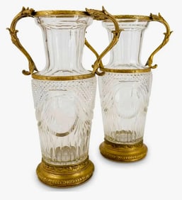 A PAIR OF ORMOLU MOUNTED BACCARAT CRYSTAL VASES