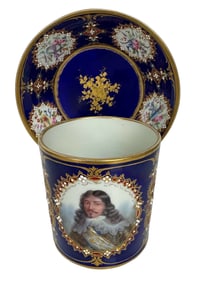 A MAGNIFICENT JEWELLED SEVRES CUP AND SAUCER
