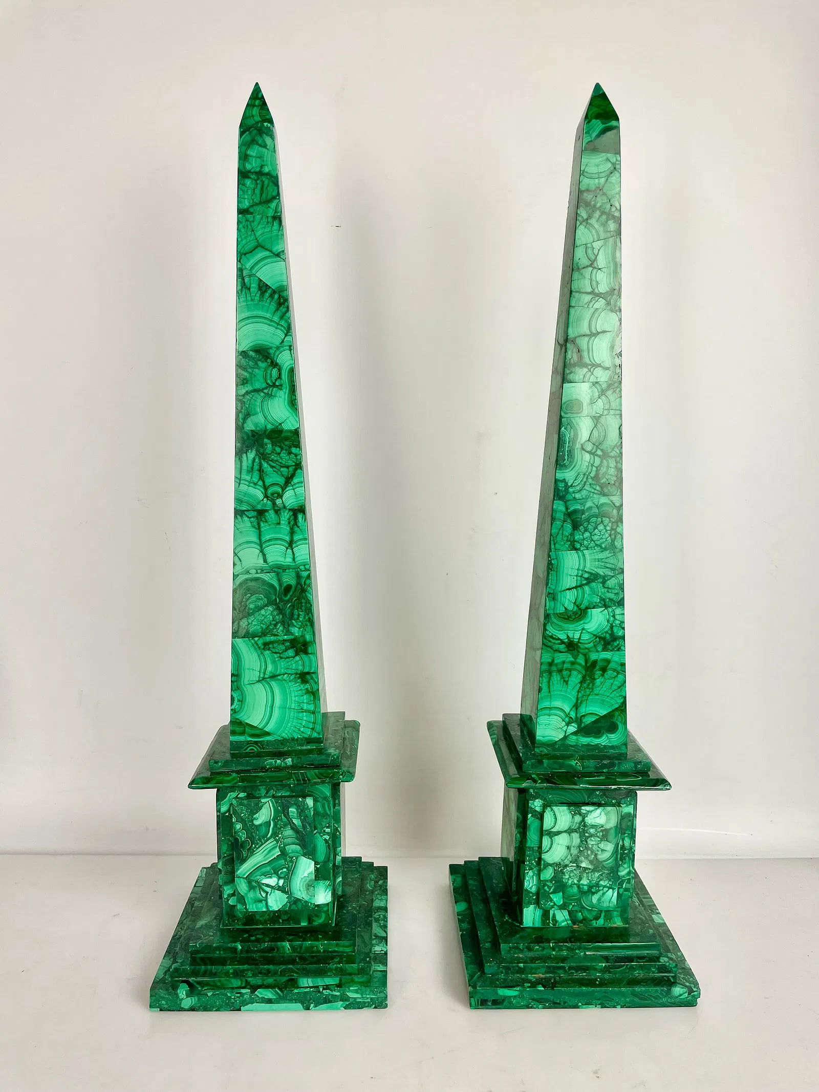 A PAIR OF MALACHITE OBLISQUES: Measure 20 inches high. In good condition. Estimate $1500-2000