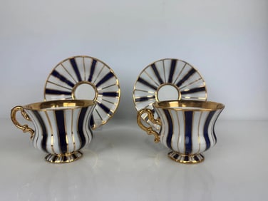 A PAIR OF MEISSEN CUP AND SAUCERS