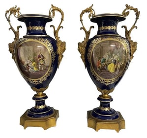 A PALATIAL PAIR OF ORMOLU MOUNTED SEVRES PORCELAIN VASES