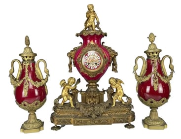 A LARGE DORE BRONZE AND SEVRES PORCELAIN CLOCK GARNITURE