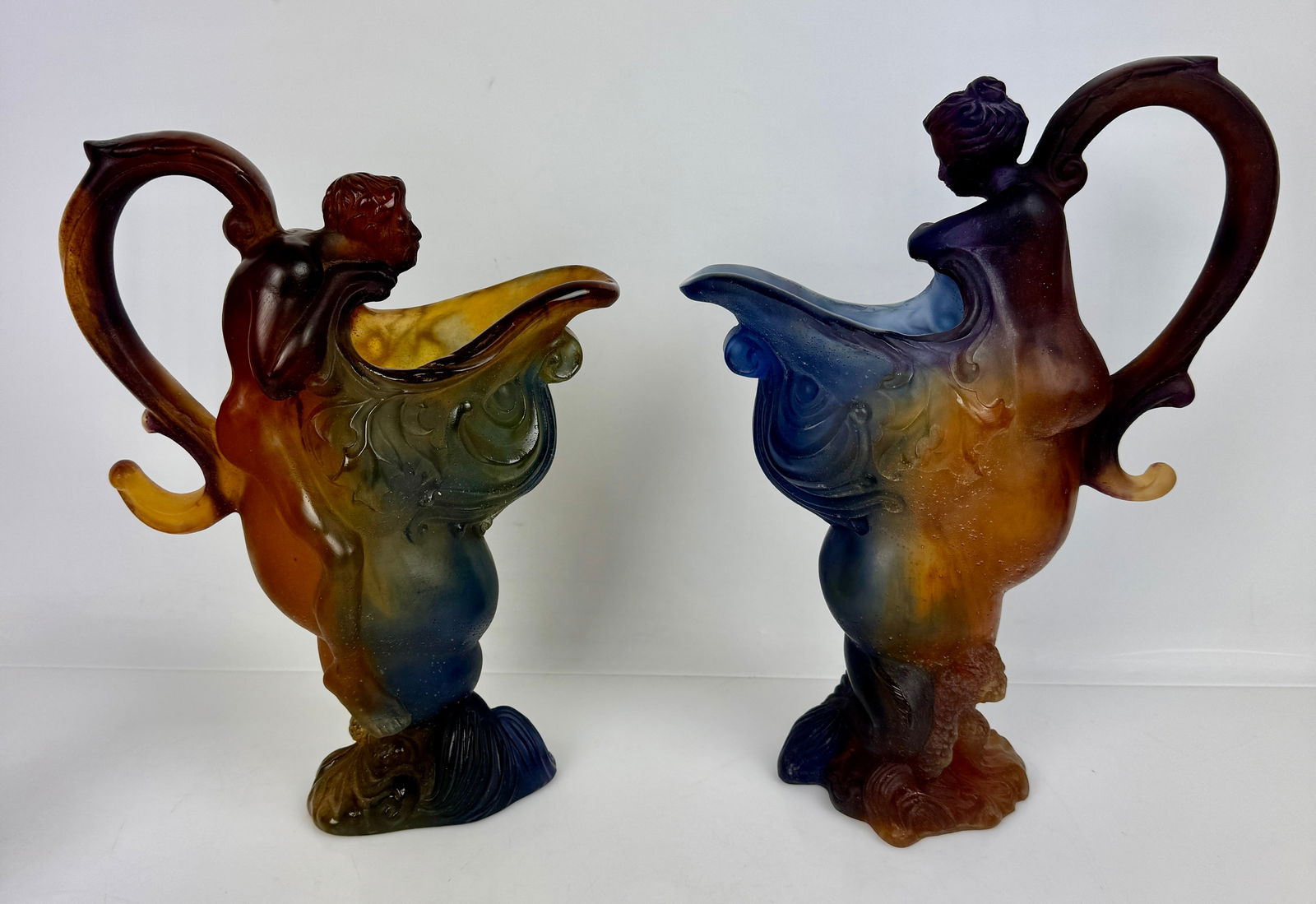 A PAIR OF DAUM PATE DE VERRE GLASS EWERS