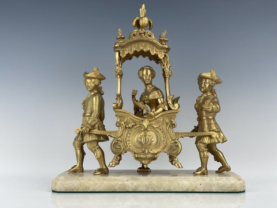 DORE BRONZE CARRIAGE: French gilt bronze figural group, featuring women inside a carriage coach, held by two men on either side, on an onyx slab base. Circa 1900. [11 1/2 inches H x 11 inches W x 4 inches D]. Good antique