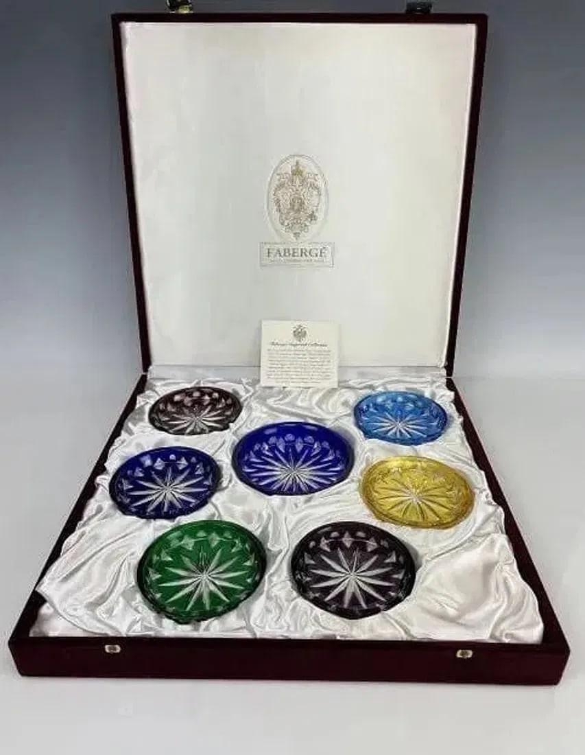A SET OF IMPERIAL FABERGE CUT CRYSTAL COASTERS: All like new in original presentation box. Estimate $800-1.000