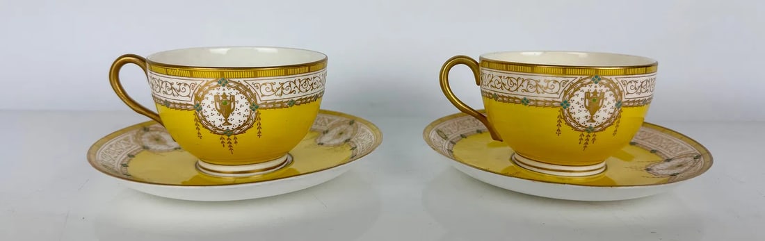 A PAIR OF ROYAL WORCESTER PORCELAIN CUP AND SAUCERS: Circa 1900. In excellent condition. Estimate $500-600