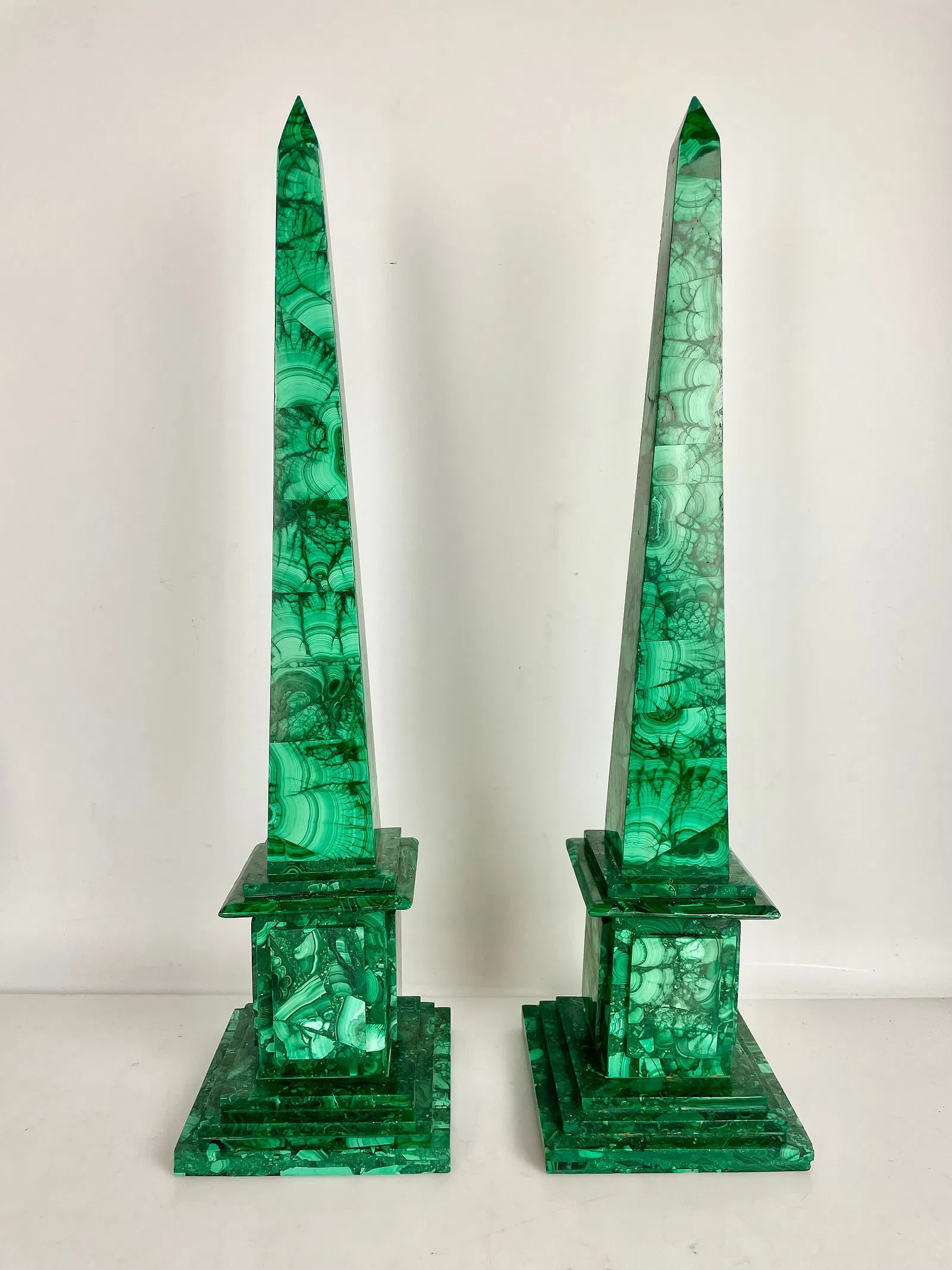 A PAIR OF MALACHITE OBLISQUES: Measure 20 inches high. In good condition. Estimate $1500-2000