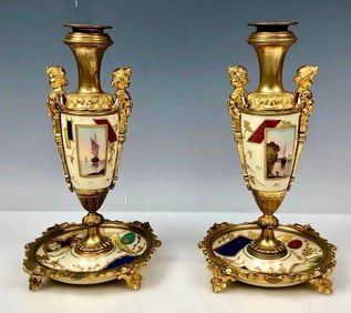 A PAIR OF ORMOLU MOUNTED PARIS PORCELAIN CANDEL HOLDERS