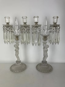 A PAIR OF BACCARAT ENFANT CANDELABRA