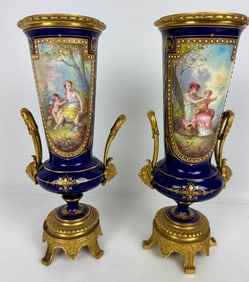 A PAIR OF ORMOLU MOUNTED SEVRES PORCELAIN VASES