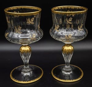 A PAIR OF GILT DAUM NANCY WINE GLASSES