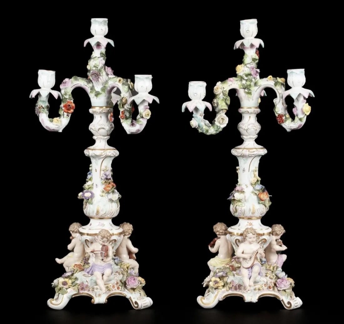 A LARGE PAIR OF MEISSEN CANDELABRA: 19th century, porcelain. The true pair, after Ernst August Leuteritz, each of four bobeche lights presented on arms of flowering vines, the standards painted with insects, the scrolling bases each bea