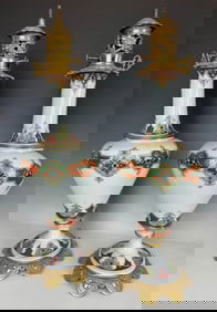 A PAIR OF FRENCH PORCELAIN AND ORMOLU VASES/LAMPS