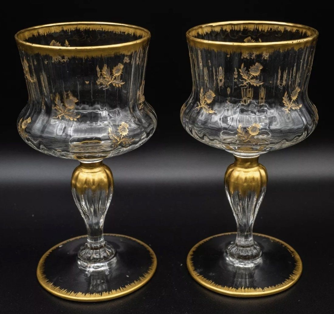 A PAIR OF GILT DAUM NANCY WINE GLASSES: Circa 1900. Measure 5.5inches tall. In good antique condition, minor age related gold loss.Estimate $600-800