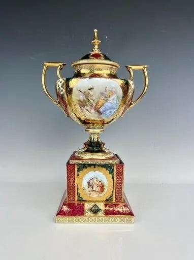 ROYAL VIENNA STYLE PORCELAIN VASE AND COVER: Circa 1920. Measures 14 inches high. In good antique condition, minor loss of gold. Estimate $450-500