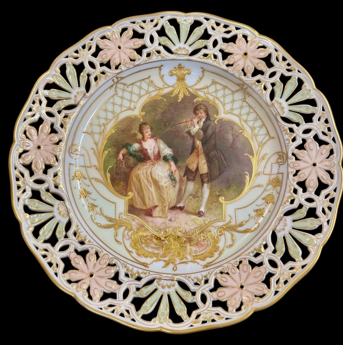 BERLIN KPM RETICULATED AND ENAMELLED PLATE: Circa 1900. Measures 9 inches d. In excellent condition. Estimate $1500-2000